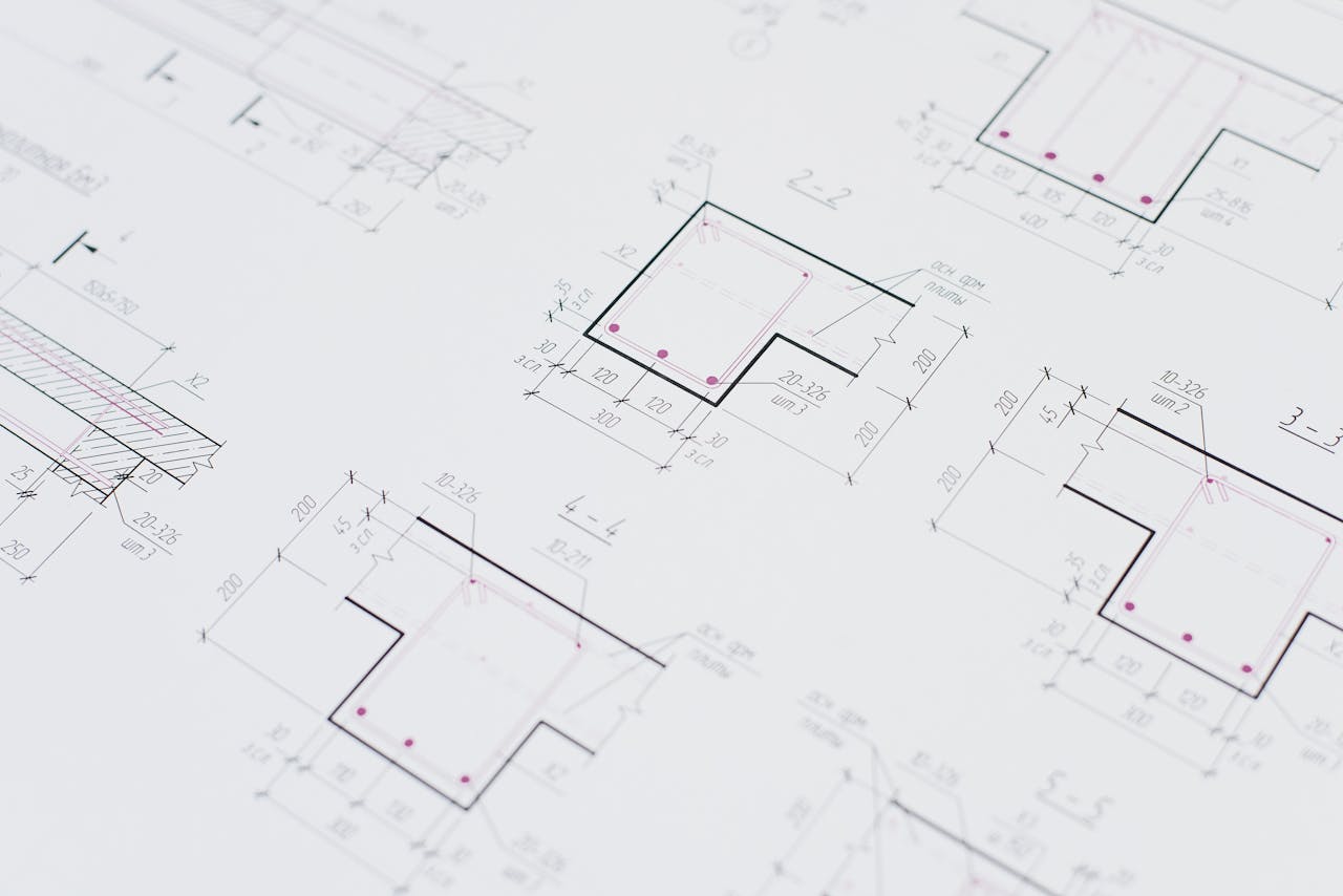 services-01 High-resolution close-up of detailed architectural blueprints showcasing precision design layouts.